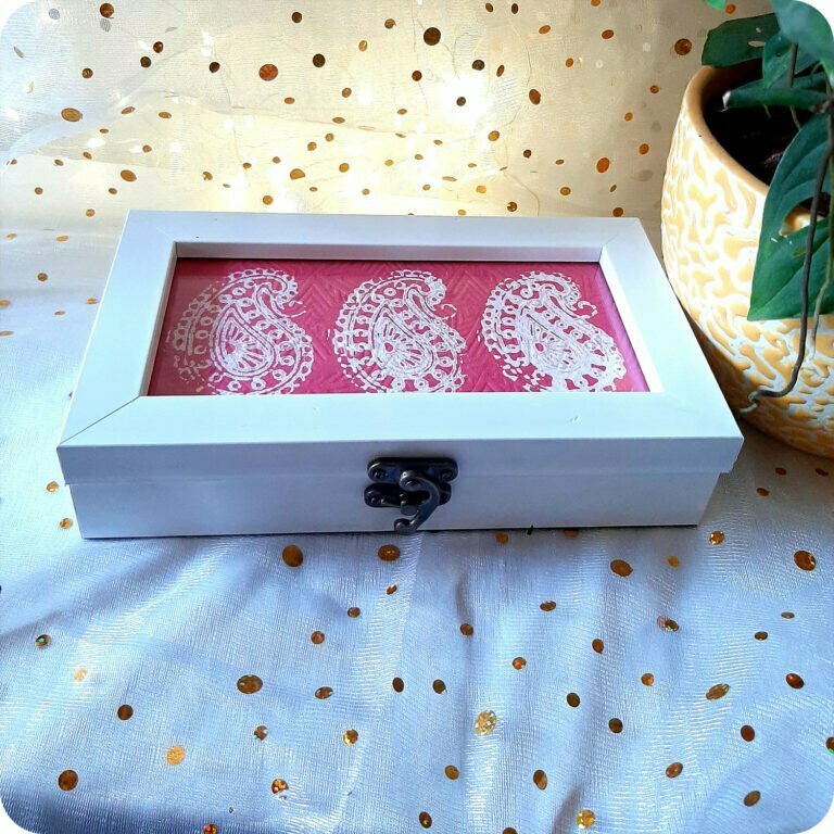 White color box with red intricate design