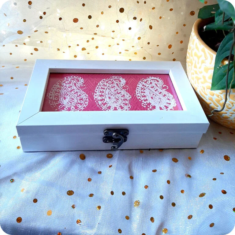 White color box with red intricate design