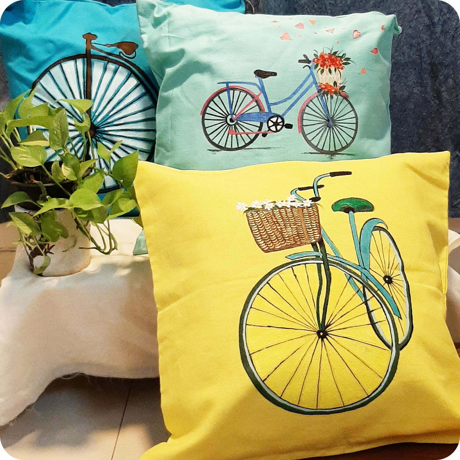 Set of colourful square cushions with Cycle design